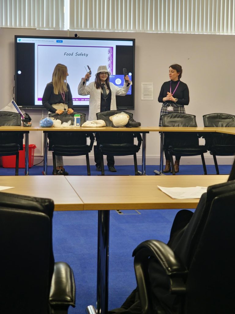 Accrington academy student with two Council officers