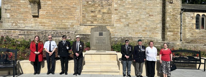 8 People stood near the Pals memorial near St James' Church, Accrington