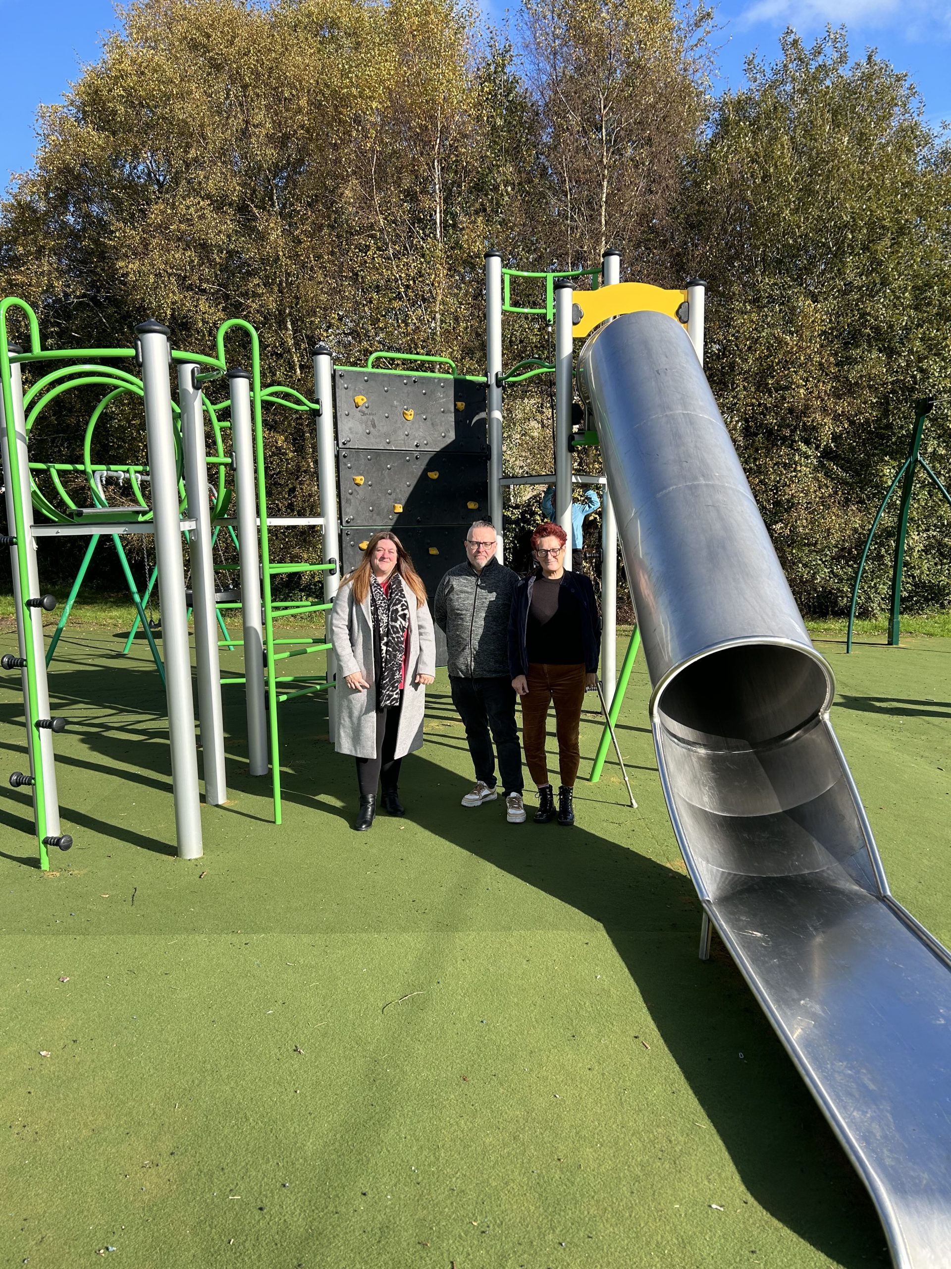 Three Councillors, slide and play equipment in background