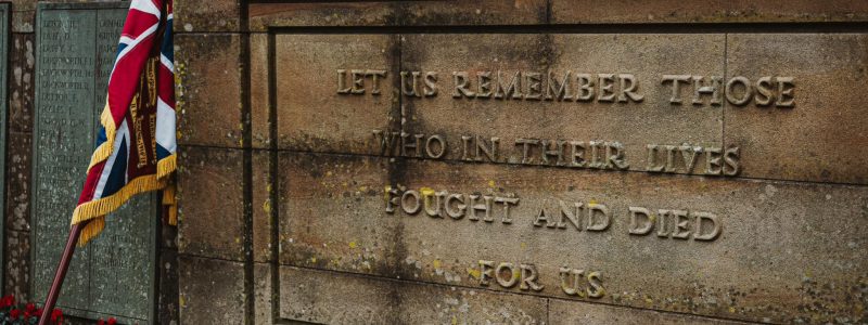 War memorial, poppies and Union Flag