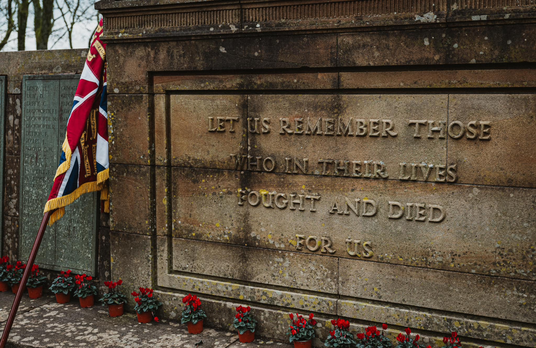 War memorial, poppies and Union Flag