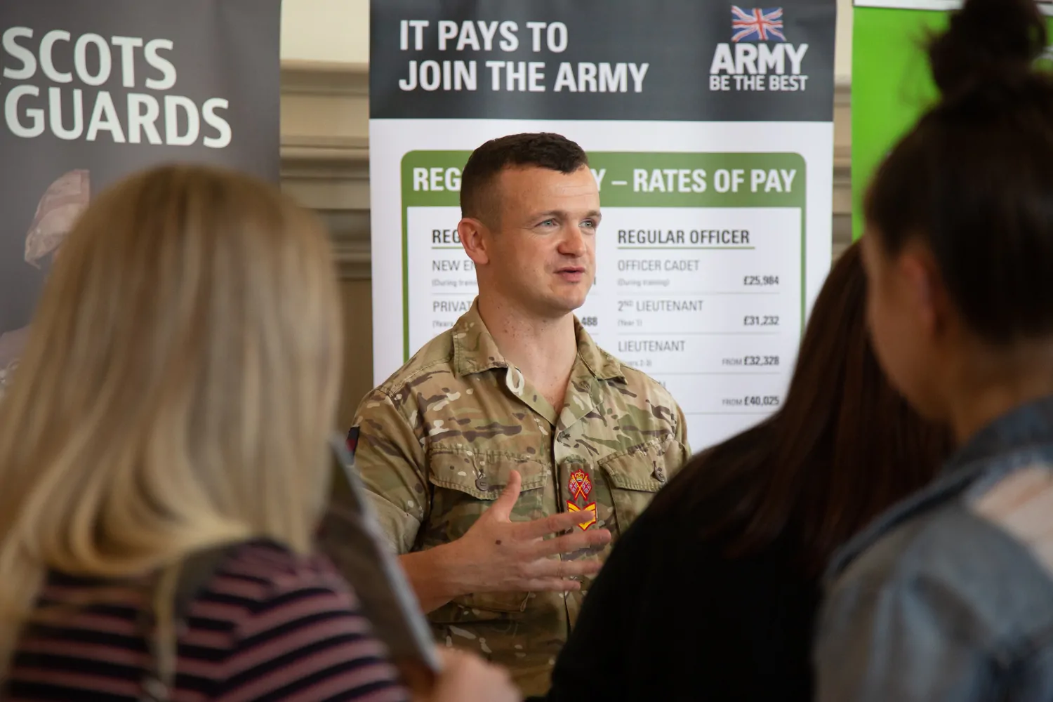 A person in military uniform giving a presentation