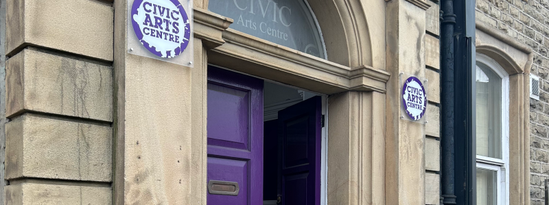 Purple doors on front of theatre building