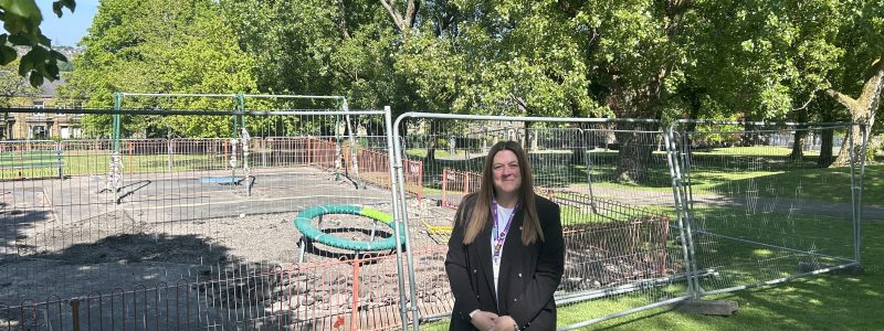 Person outside play area under construction