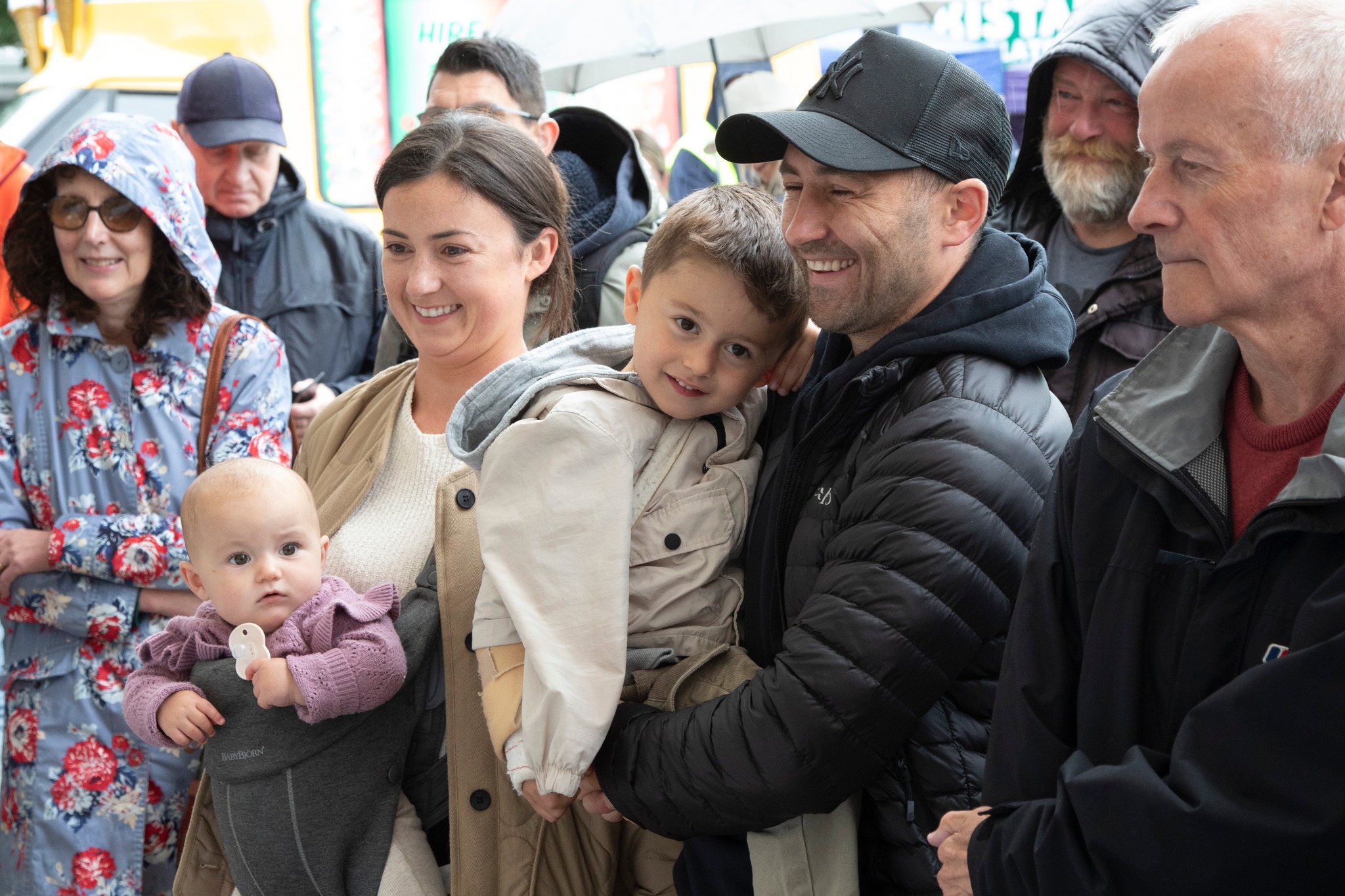 A family stood together smiling