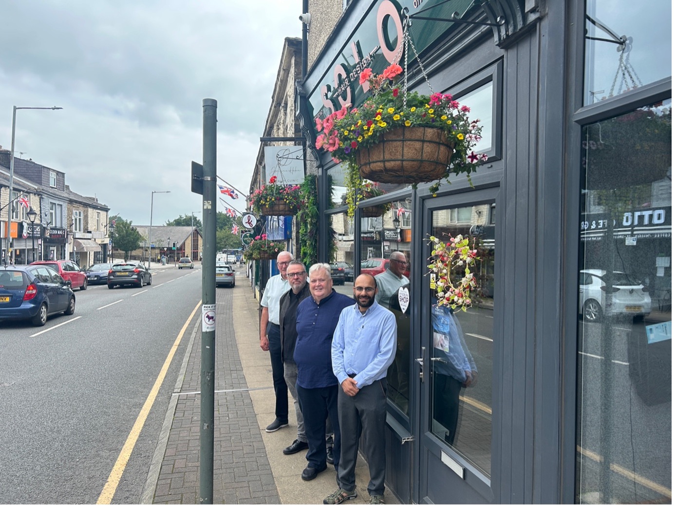 A group of people stood on a high street