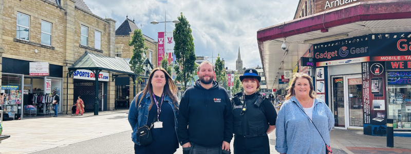 Four people stood in town centre