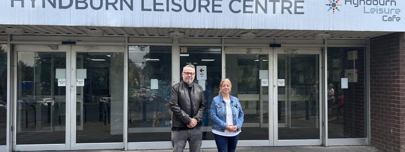Two people outside leisure centre
