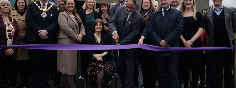 People gathered at ribbon cutting event