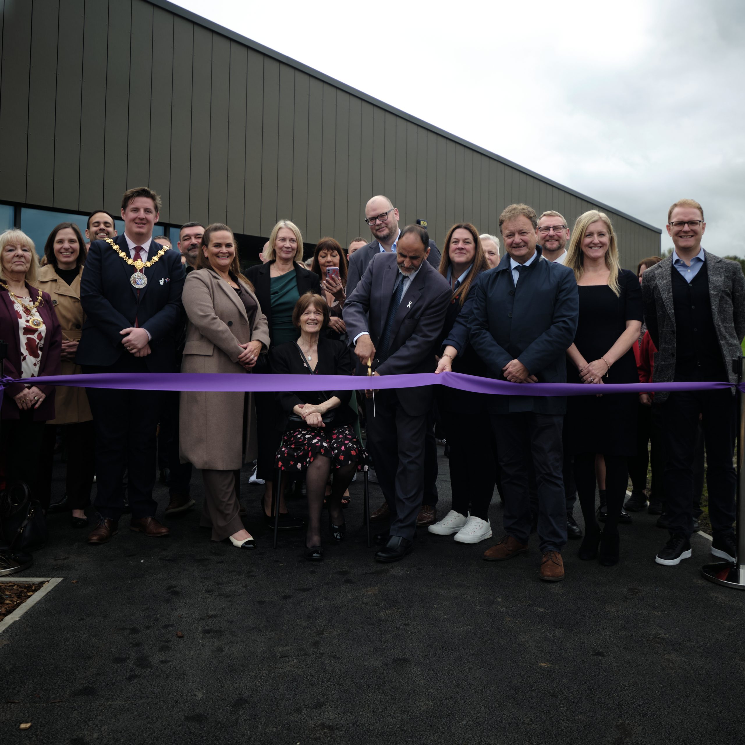 People gathered at ribbon cutting event