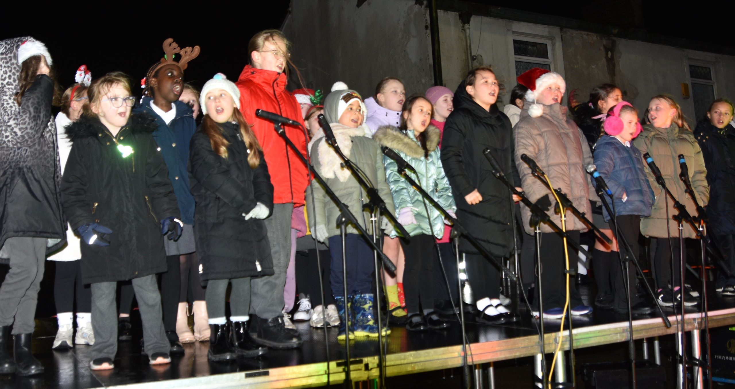 Children on stage at a Christmas Lights Switch On