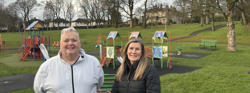 Two people with park in background
