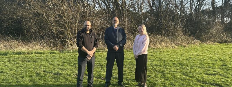 Three people in a field