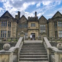 Image of the from of Haworth Art Gallery and Museum taken from below the front steps. 