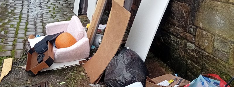 Rubbish piled on a back street